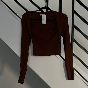 Large. Burnt orange. Long sleeve cropped top. Never worn.